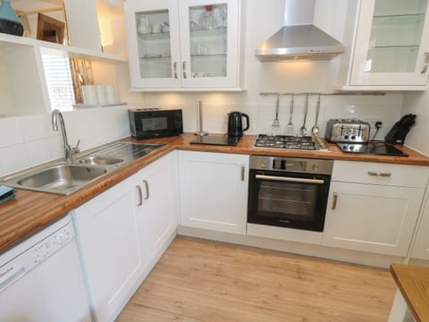 Fridge, electric kettle, toaster, cookware/dishes/utensils