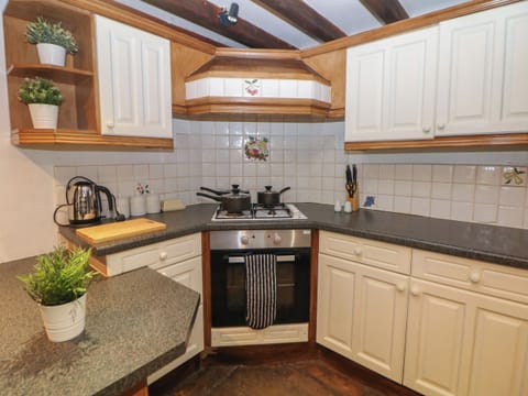 Fridge, electric kettle, cookware/dishes/utensils