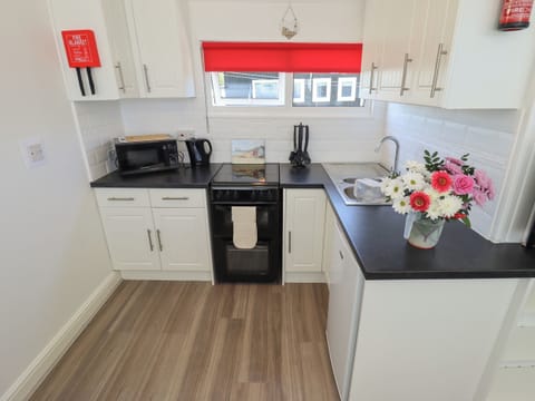 Fridge, electric kettle, toaster, cookware/dishes/utensils