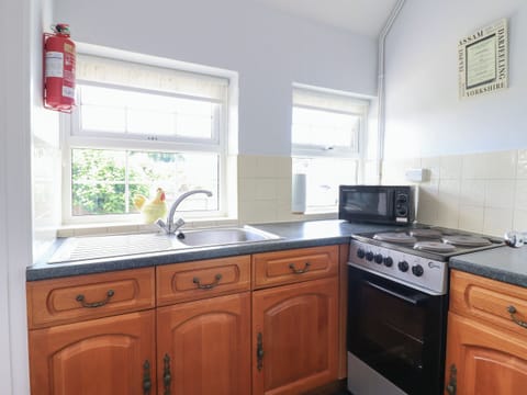 Fridge, electric kettle, toaster, cookware/dishes/utensils