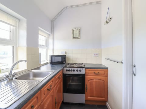 Fridge, electric kettle, toaster, cookware/dishes/utensils