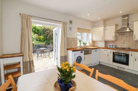 Fridge, electric kettle, toaster, cookware/dishes/utensils