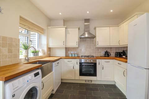 Fridge, electric kettle, toaster, cookware/dishes/utensils