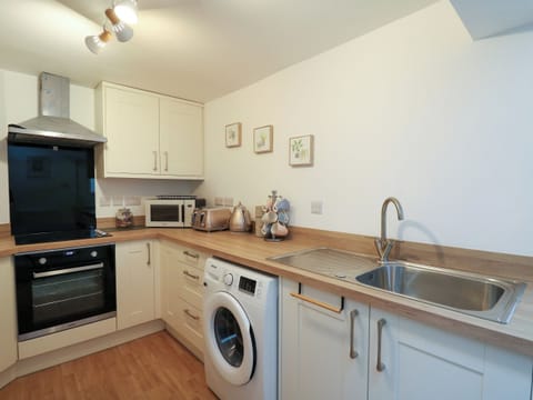 Fridge, electric kettle, toaster, cookware/dishes/utensils