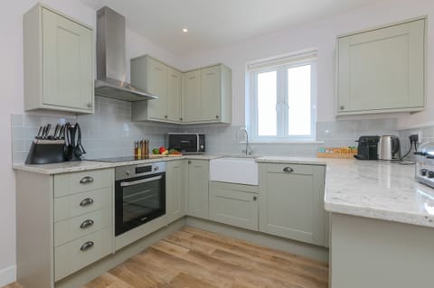 Fridge, electric kettle, toaster, cookware/dishes/utensils