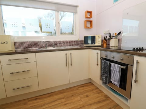 Fridge, electric kettle, toaster, cookware/dishes/utensils