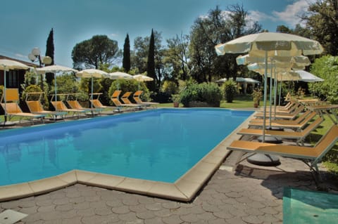 Seasonal outdoor pool, open 9:00 AM to 7:00 PM, pool umbrellas