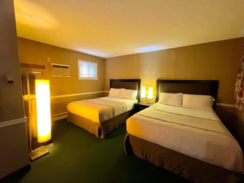 Deluxe Room, 2 Queen Beds | Laptop workspace, free WiFi, bed sheets