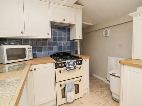 Fridge, electric kettle, toaster, cookware/dishes/utensils