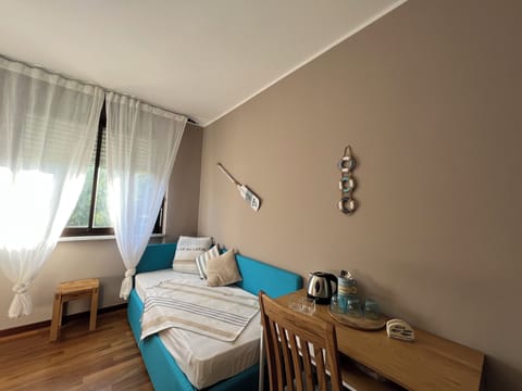 Family Triple Room, Park View | In-room safe, desk, laptop workspace, free WiFi