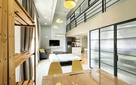 Deluxe Duplex, City View | Living area | 45-inch Smart TV with digital channels