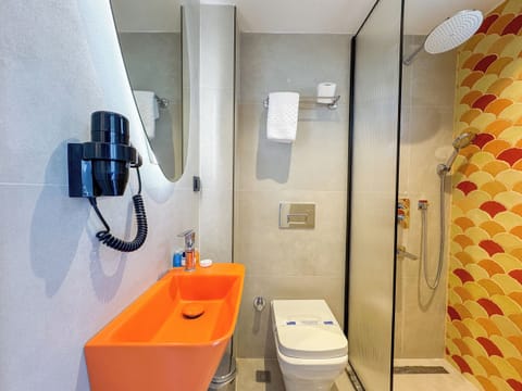 Shower, hair dryer, slippers, towels