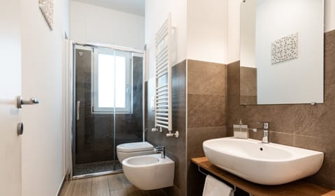 Triple Room | Bathroom | Shower, hair dryer, towels, soap
