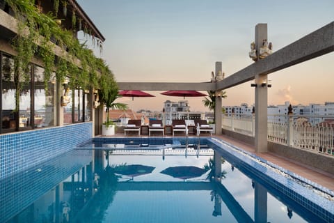 Outdoor pool, open 8:00 AM to 9:00 PM, pool umbrellas, sun loungers