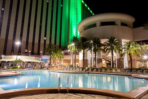 Outdoor pool, open 6:00 AM to midnight, pool umbrellas, sun loungers