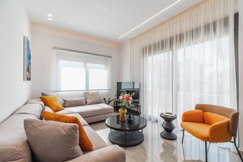 Comfort Apartment | Living area | 55-inch Smart TV with cable channels