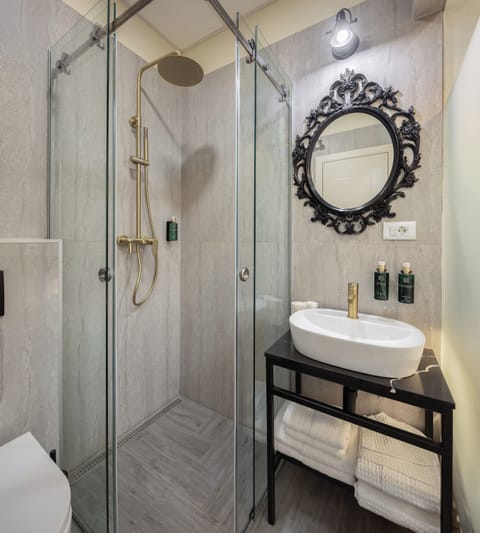 Luxury Room 2 | Bathroom | Shower, hair dryer, slippers, towels