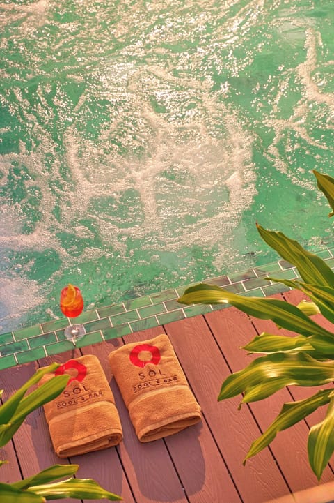 Outdoor pool, open 8:00 AM to 8:30 PM, pool umbrellas, sun loungers
