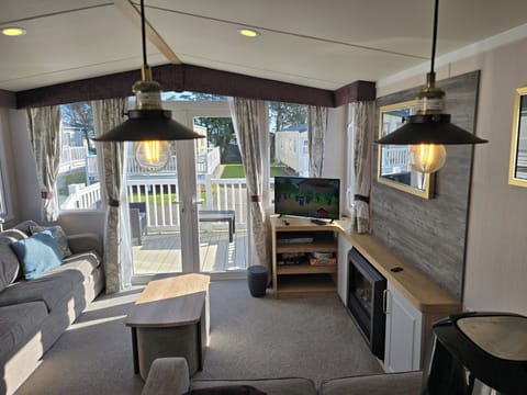 Cabin | Living area | TV, fireplace