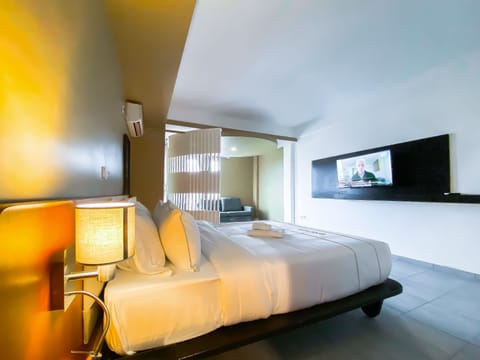 Junior Suite, Pool View | In-room safe, soundproofing, iron/ironing board, free WiFi