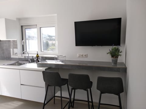 Superior Triple Room, 1 Bedroom | Private kitchen | Fridge, stovetop, coffee/tea maker, electric kettle