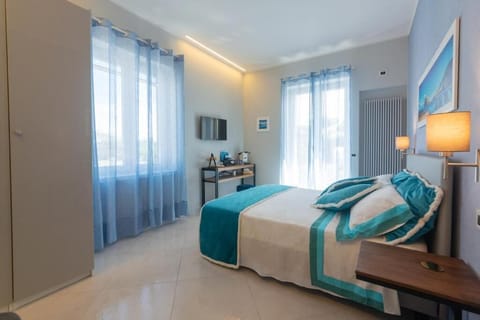 Deluxe Room, Balcony | In-room safe, blackout drapes, soundproofing, iron/ironing board