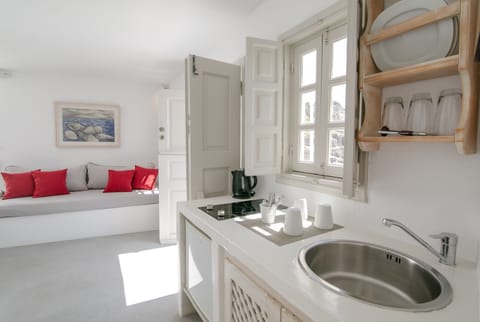 Suite, Sea View (Cave) | Living area | Flat-screen TV