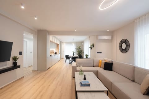 Deluxe Apartment, 4 Bedrooms, City View | Living area | 50-inch Smart TV with cable channels