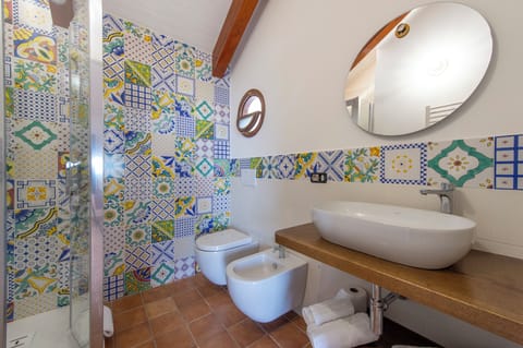 Deluxe Quadruple Room | In-room safe, desk, laptop workspace, blackout drapes