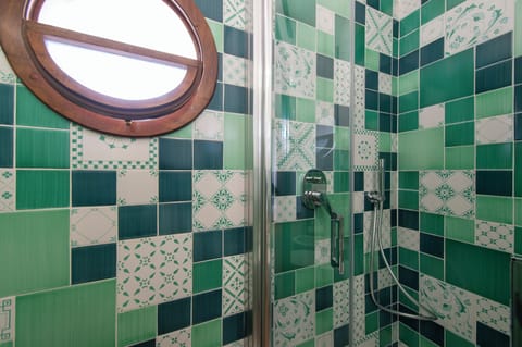 Deluxe Quadruple Room, Sea View | In-room safe, desk, laptop workspace, blackout drapes