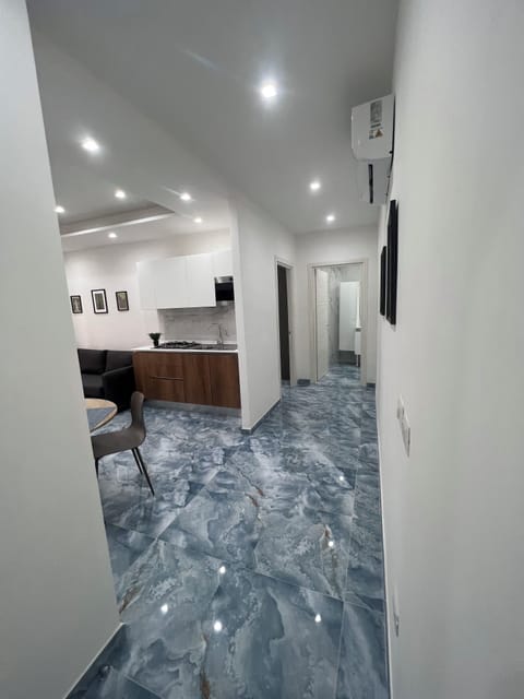 Deluxe Apartment, Kitchen | In-room safe, blackout drapes, iron/ironing board, free WiFi