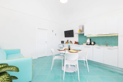 Apartment, Sea View | Living area | 32-inch flat-screen TV with digital channels