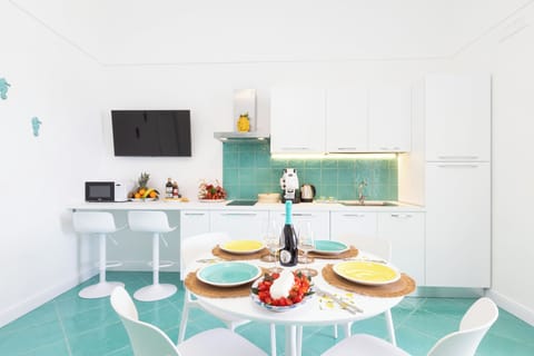 Apartment, Sea View | Living area | 32-inch flat-screen TV with digital channels