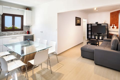 Deluxe Apartment, Sea View | Living area | TV