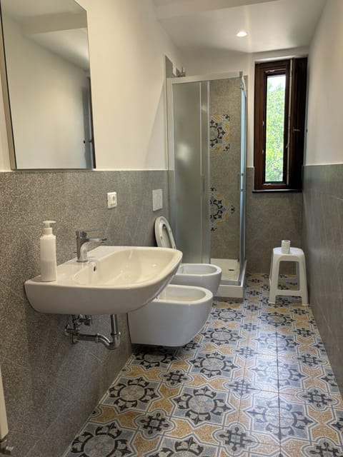 Shower, hair dryer, bathrobes, towels