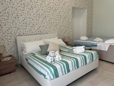 Comfort Quadruple Room, Garden View | Laptop workspace, free WiFi