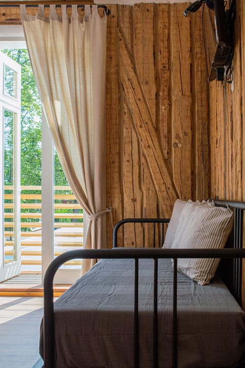 Comfort Triple Room, Balcony, Park View | Living area | Flat-screen TV, heated floors