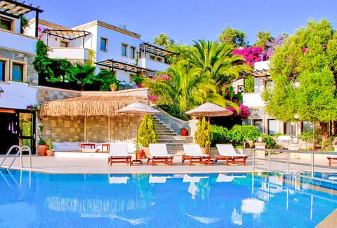 Outdoor pool, pool umbrellas, sun loungers