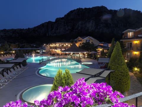 Seasonal outdoor pool, open 8:30 AM to 7 PM, pool umbrellas