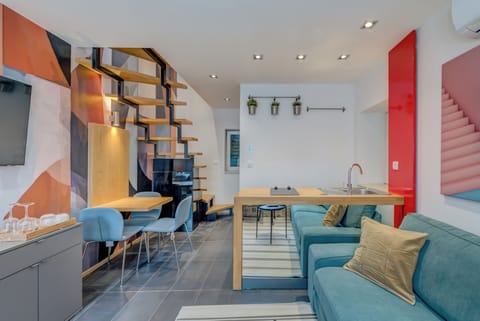 Apartment, 2 Bedrooms | Living area | 100-cm flat-screen TV with cable channels