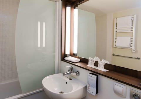 Eco-friendly toiletries, hair dryer, towels