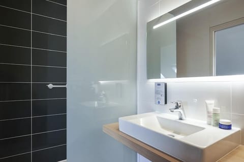 Shower, eco-friendly toiletries, hair dryer, towels