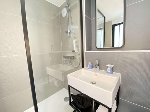 Shower, eco-friendly toiletries, hair dryer, towels