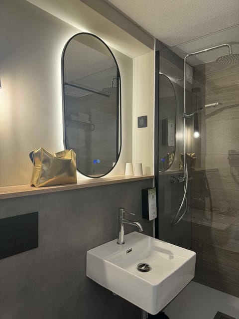 Shower, rainfall showerhead, eco-friendly toiletries, hair dryer