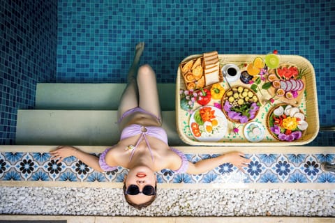 Indoor pool, open 7:00 AM to 10:00 PM, pool umbrellas, sun loungers