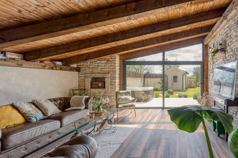 Family House, 2 Bedrooms, Fireplace (Villa Capadinka with Whirlpool) | Living area | Flat-screen TV