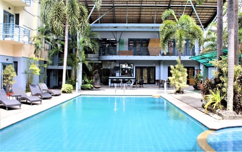 Outdoor pool, open 6:00 AM to 8:00 PM, pool umbrellas, sun loungers