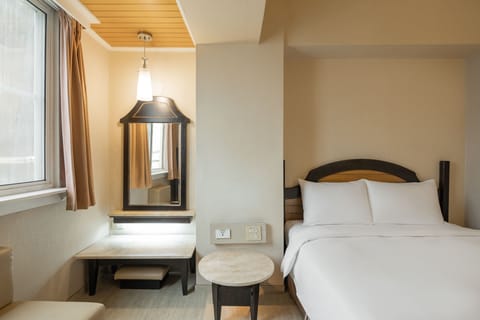 Standard Double Room | Living area | 32-inch LED TV with cable channels, TV