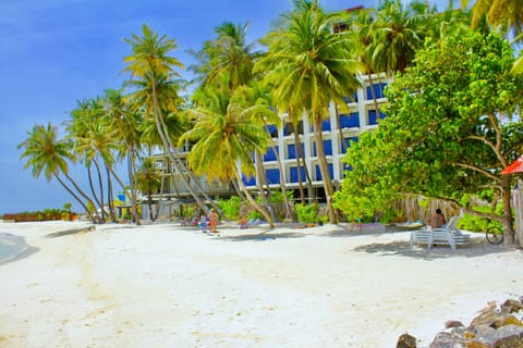 Beach nearby, white sand, beach umbrellas, beach towels