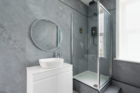 Shower, slippers, towels, soap